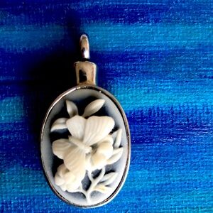 Vintage butterfly flower cameo style. George forever with me on backside.